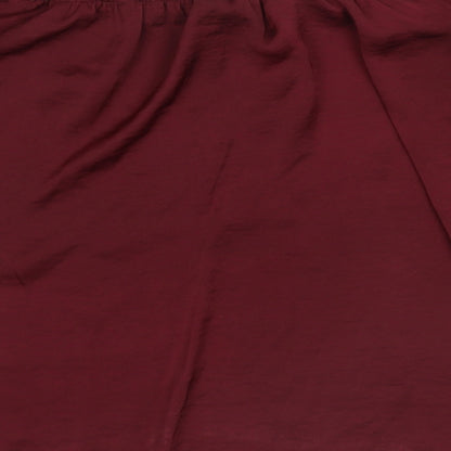Brand and care label for River Island women’s red basic blouse, size UK 12