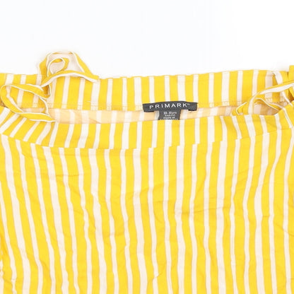 Close-up detail of Primark girls’ yellow striped basic blouse, size 10-11, years