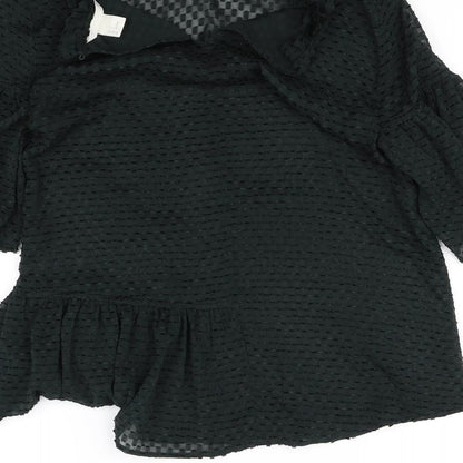 Brand and care label for H&M women’s black basic blouse, size UK 6