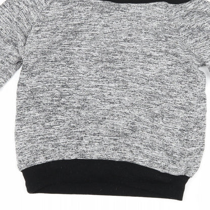 Brand and care label for Select women’s grey jumper, size S