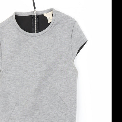 Close-up detail of H&M women’s grey basic t-shirt, size UK 4