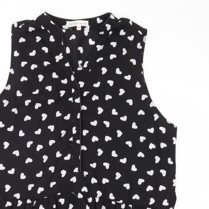 Close-up detail of Millenium women’s black polka dot chiffon basic blouse, size M