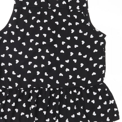 Brand and care label for Millenium women’s black polka dot chiffon basic blouse, size M