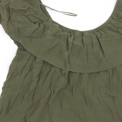 Brand and care label for Miss Selfridge women’s green basic blouse, size UK 10