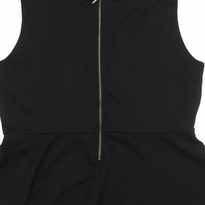 Brand and care label for H&M women’s black basic blouse, size L