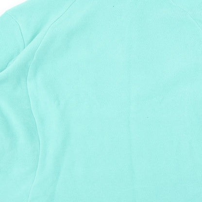 Brand and care label for Quechua women’s green jumper, size L