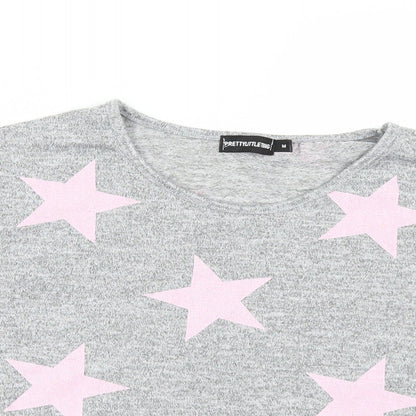 Close-up detail of PRETTYLITTLETHING women’s grey polka dot basic t-shirt, size M
