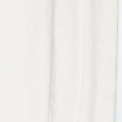 Brand and care label for Candy Couture girls’ white denim skinny jeans, size 13, years