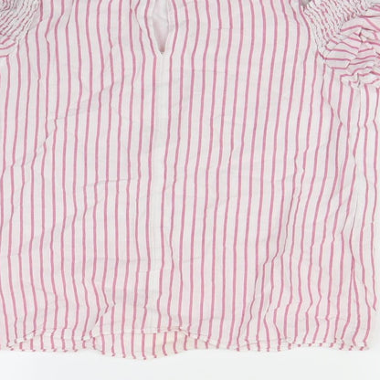 Brand and care label for F&F girls’ white striped basic blouse, size 10, years