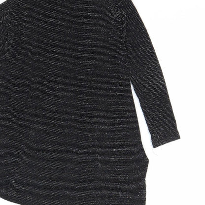 Brand and care label for Cosmic Kids girls’ black basic blouse, size 7, years