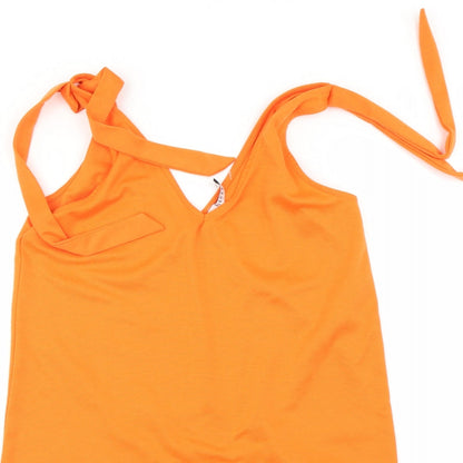 Close-up detail of Pieces women’s orange basic t-shirt, size S