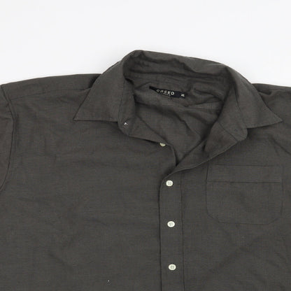 Close-up detail of Creed men’s grey button-up, size XL