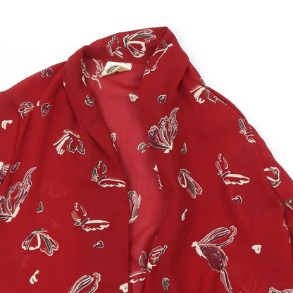 Close-up detail of Cleo women’s red animal print basic blouse, size UK 14