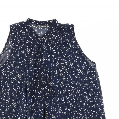 Close-up detail of Oakridge women’s blue polka dot basic blouse, size M