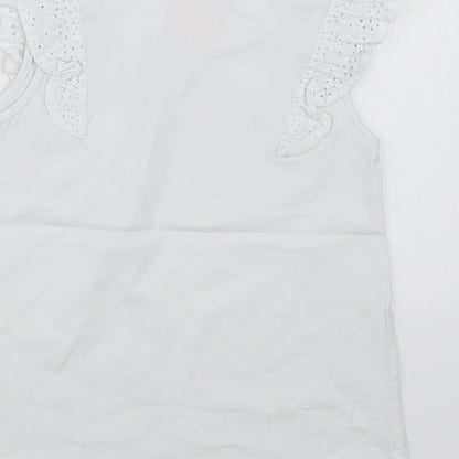 Brand and care label for Next girls’ white basic tank, size 5-6, years
