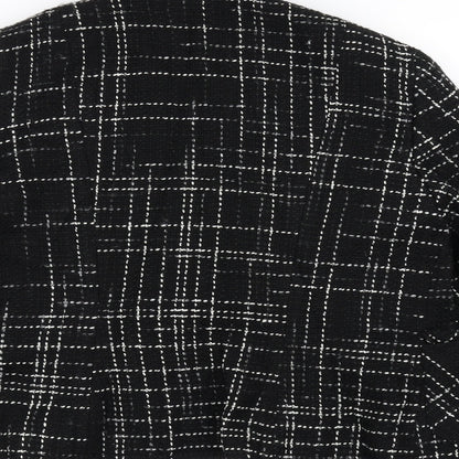 Brand and care label for Marks & Spencer women’s black overcoat coat, size UK 14