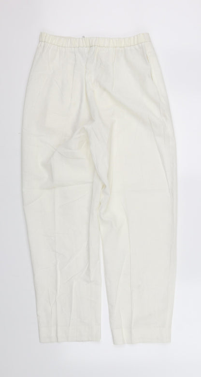 Back view of pre worn women’s silver trousers, size UK 14, 28-inch leg