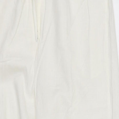 Close-up detail of pre worn women’s silver trousers, size UK 14, 28-inch leg