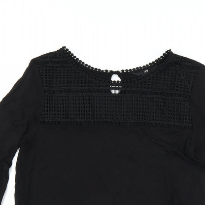 Close-up detail of H&M women’s black basic blouse, size M