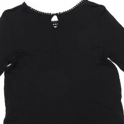 Brand and care label for H&M women’s black basic blouse, size M