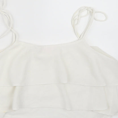 Brand and care label for Miss Selfridge women’s white chiffon cropped tank, size UK 10