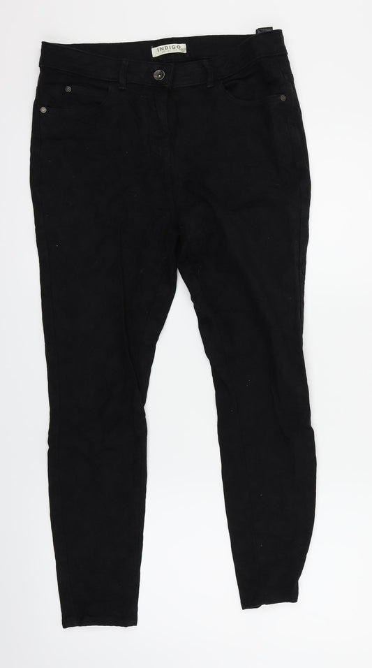 Front view of Indigo women’s black floral skinny jeans, size UK 14, 25-inch leg
