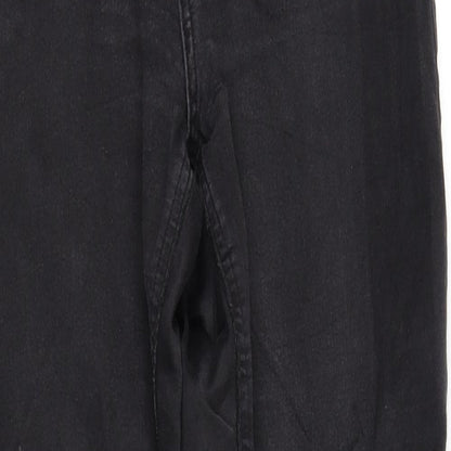 Close-up detail of pre worn women’s black trousers, size UK 10, 32-inch leg