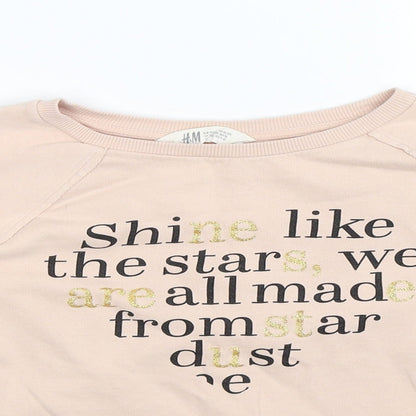 Close-up detail of H&M girls’ beige pullover sweatshirt, size 11-12, years