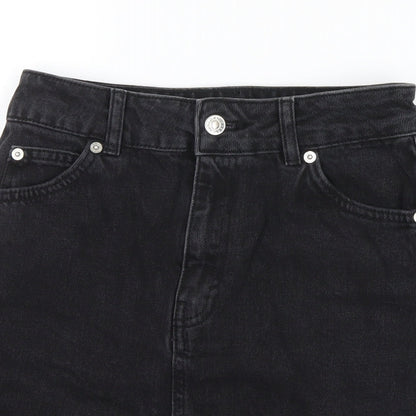 Close-up detail of Topshop women’s black denim mini skirt, size UK 6