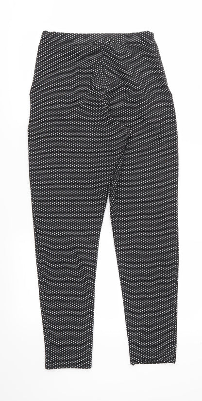 Back view of Preworn women’s black polka dot trousers, size UK 10, 28-inch leg