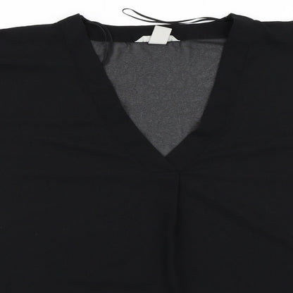 Close-up detail of H&M women’s black basic blouse, size UK 34
