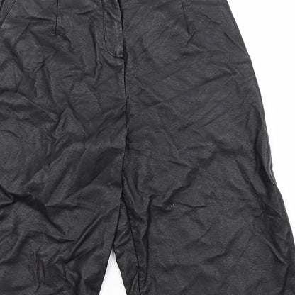 Brand and care label for Topshop women’s black utility shorts, size UK 8