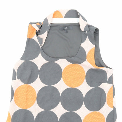 Close-up detail of ext women’s multicoloured polka dot basic blouse, size UK 8