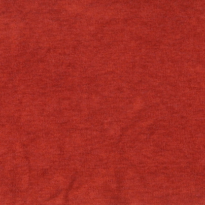 Brand and care label for H&M women’s orange jumper, size S