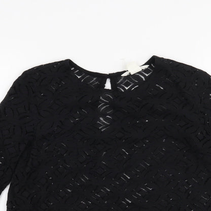 Close-up detail of H&M women’s black basic blouse, size XS