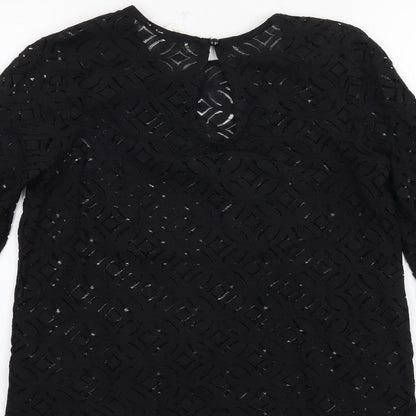 Brand and care label for H&M women’s black basic blouse, size XS