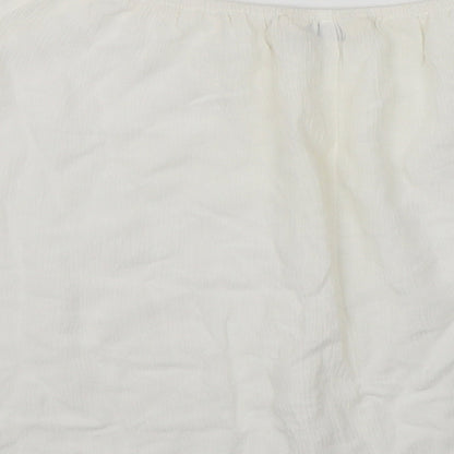 Brand and care label for Miss Selfridge women’s white basic blouse, size UK 12