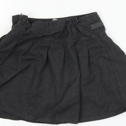 Brand and care label for Tu girls’ grey pleated skirt, size 4, years