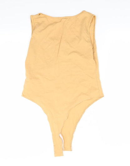 Back view of Boohoo women’s orange basic tank, size UK 14