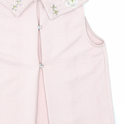 Brand and care label for Miss Selfridge women’s pink basic t-shirt, size UK 8