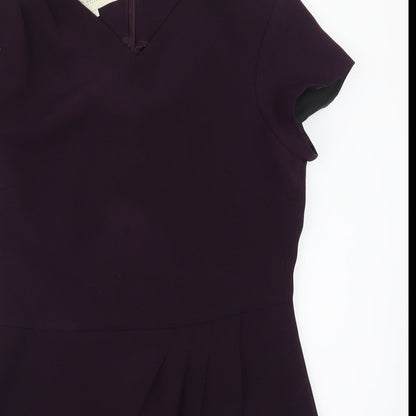 Close-up detail of Inline women’s purple basic polo, size UK 12