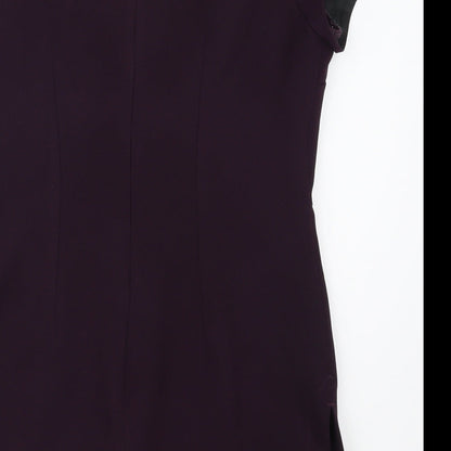 Brand and care label for Inline women’s purple basic polo, size UK 12