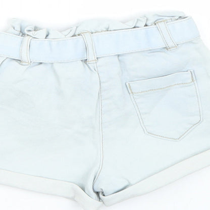Brand and care label for Tu girls’ blue cropped trousers, size 6-9, months