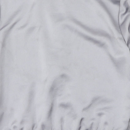 Brand and care label for Topshop women’s grey jacket, size UK 8