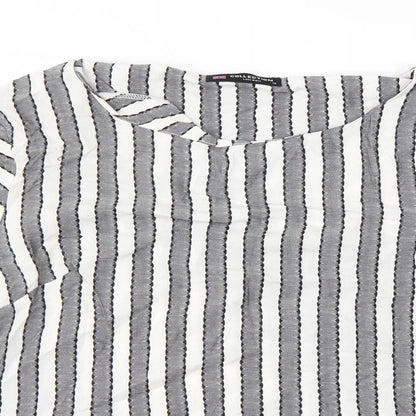Close-up detail of collection women’s grey striped basic blouse, size M