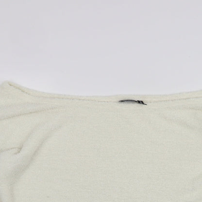Close-up detail of Oasis women’s white jumper, size UK 14