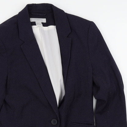 Close-up detail of H&M women’s black polka dot jacket blazer, size UK 6