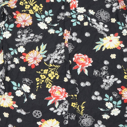 Brand and care label for Piano C women’s black floral basic blouse, size L