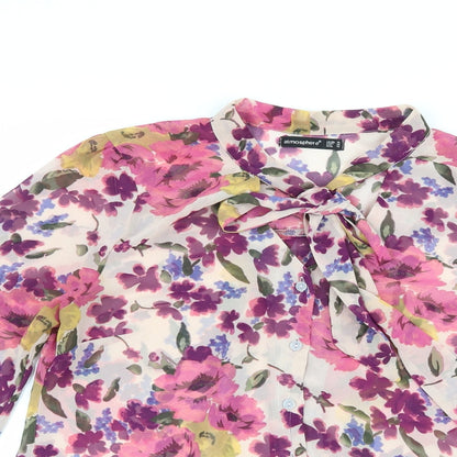 Close-up detail of Atmosphere women’s pink floral basic blouse, size UK 10