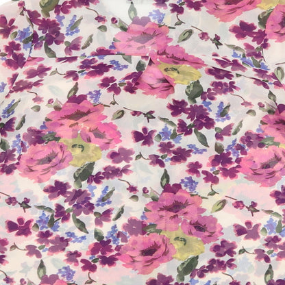 Brand and care label for Atmosphere women’s pink floral basic blouse, size UK 10